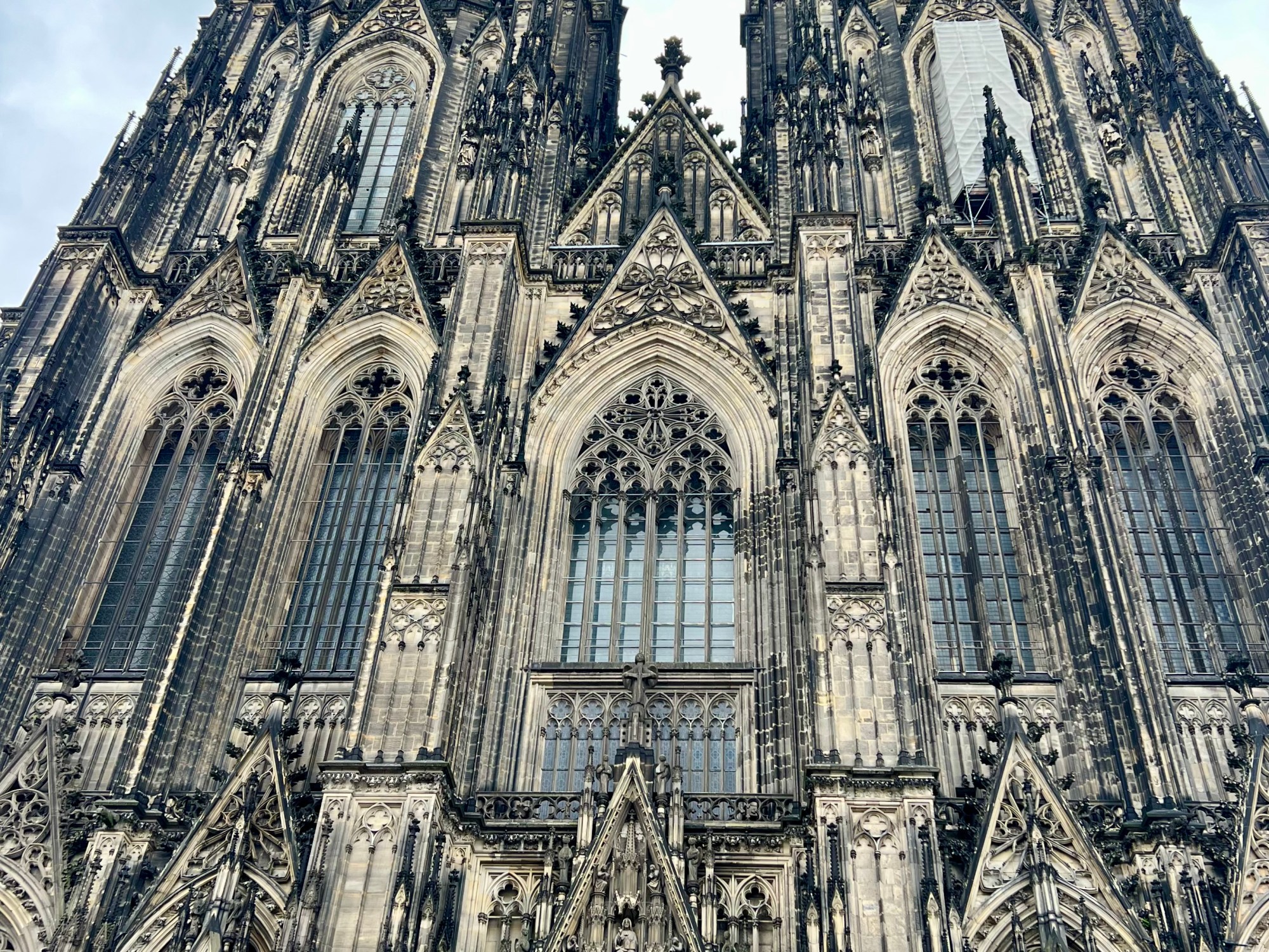 Cologne cathedral looming down with a dramatic sky